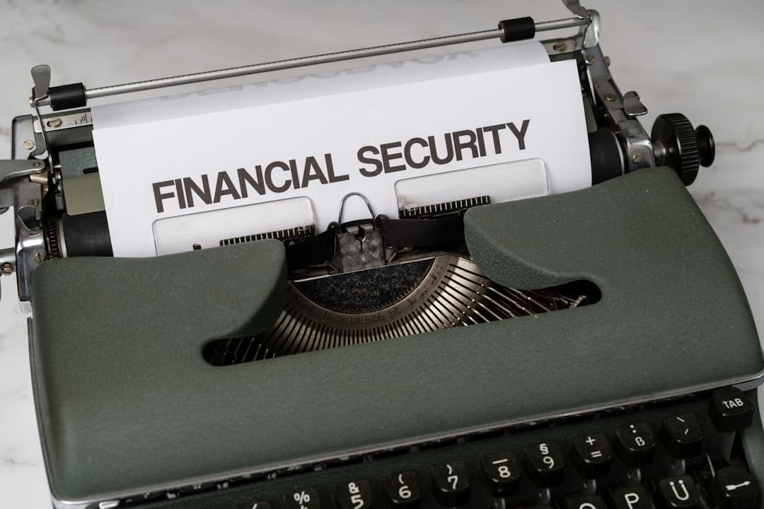 a close up of a typewriter with a financial security sign on it