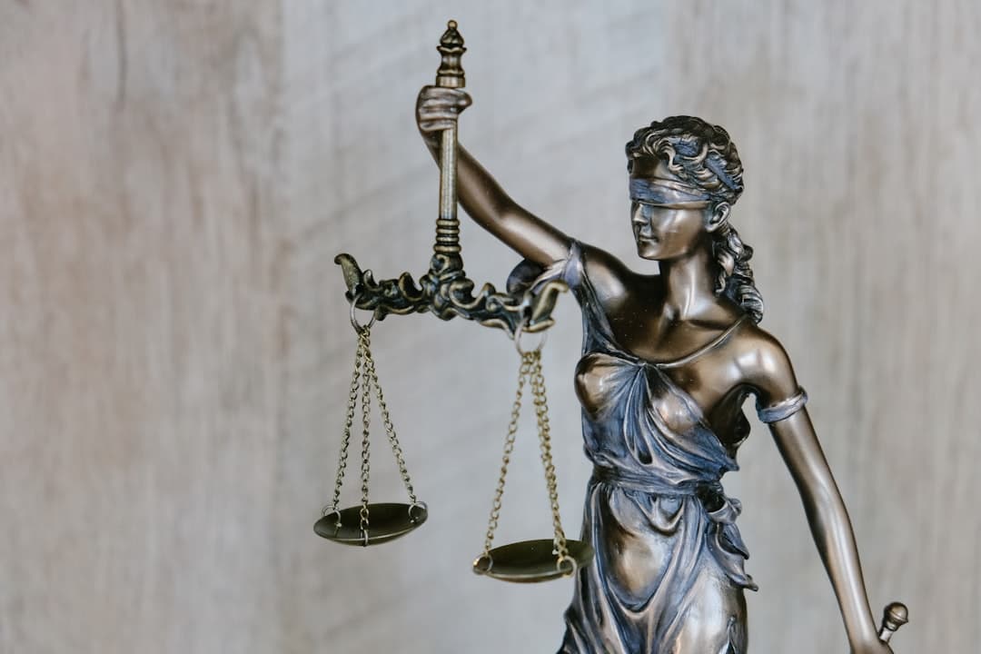 Legal scales of justice with law books